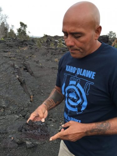 A nature guide at Volcanoes National Park explains about different types of lava.