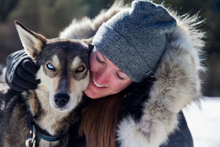 Hannah Vogel with one of her team of dogs in Montana.