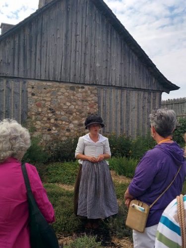 Re-enactor Fort Michilimackinac showing how early settlers grew gardens for their families.