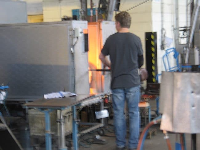 Heating the molten glass. (Photos by Susan McKee)