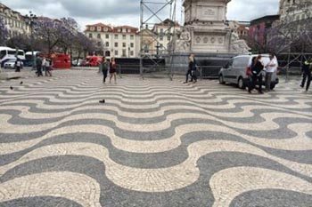 Lisbon Portugal's famous tiled sidewalks are works of art. Escape from America