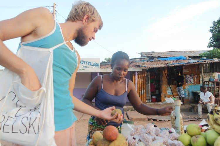 Buying fruits in the market in The Gambia.