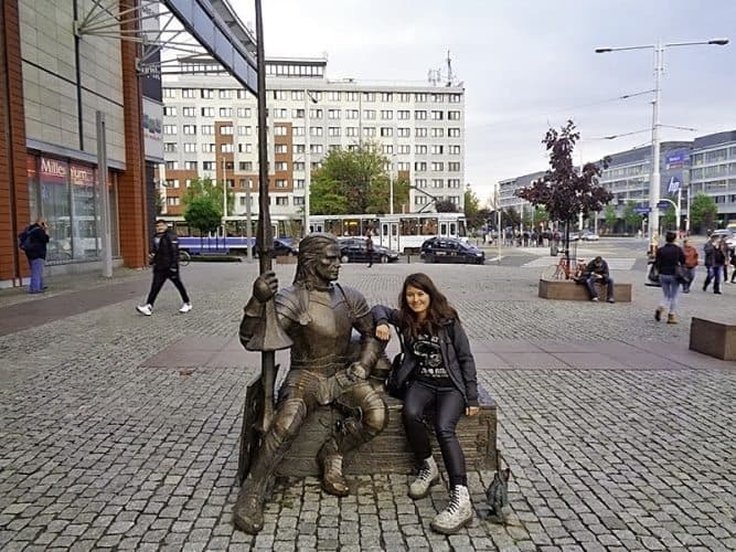 The author with the famous Knight and the Tiny Wroclaw in Posnan.