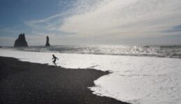 A child races the waves at Dyrholaey, Iceland. Monica Schimanke photos.