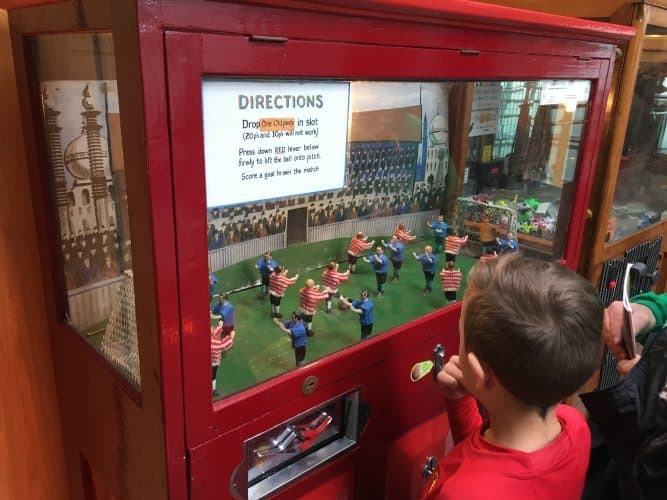 Kids play foosball inside the National Football Museum in downtown Manchester, England.