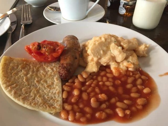 The English breakfast often includes Heinz baked beans, potato cakes, eggs, local sausage and grilled tomatoes. Here, served in the Principal Manchester Hotel.