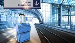 Travel Insurance. Blue suitcase at the railway station