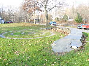This salamander rock sculpture in Cushman Village was created by local artist John Sendelbach.