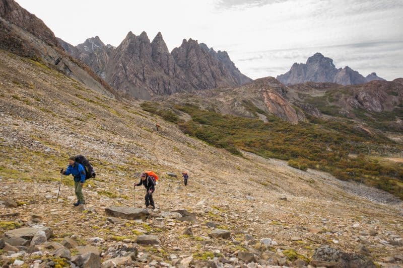 Hikers heading up a rocky mountainside.