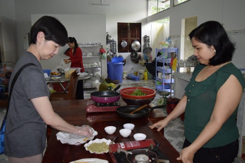 Cooking lessons in the Mekong Delta. Here, making tofu.