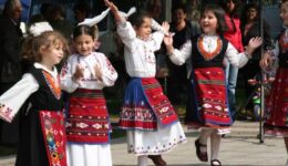 Every region in Bulgaria has its own costumes - white and black with red skirt are typical for Apriltsi