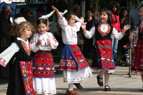 Every region in Bulgaria has its own costumes - white and black with red skirt are typical for Apriltsi
