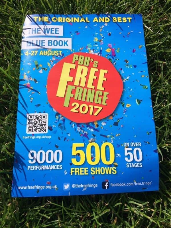 You will want a copy of the Wee Blue Book, which lists the myriad performers during the big festival.