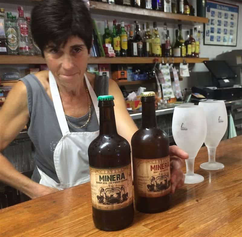 A tavern server, serious about her trade. At Hostel Can Costas in Ogassa, Spain.