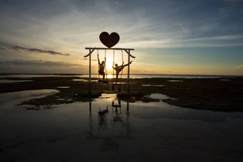 Messing around on the swings at sunset, what a sight!