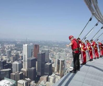 CN-Tower Toronto: if you are daring enough, you can hang off the edge like these guys are doing!