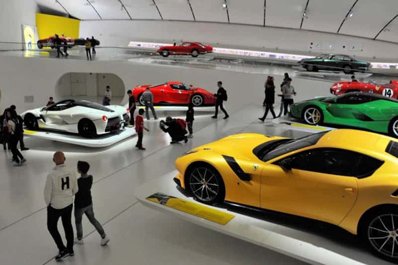 Parma Italy: Ham, Cheese, and Speed 6 Visitors explore the many Ferraris and Ferrari models in the gift shop at The Ferrari Museum.