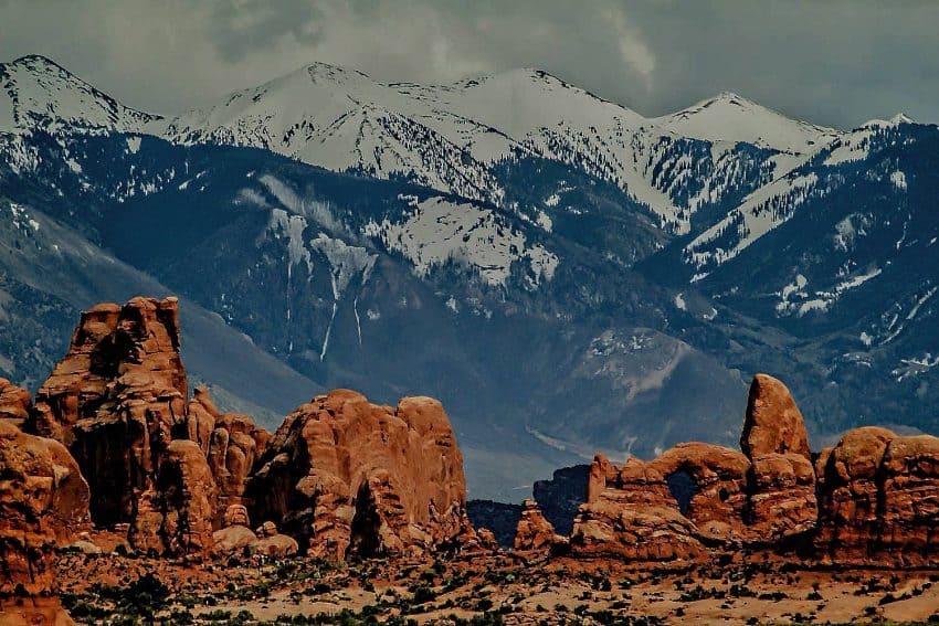 The Devils Garden trail provides awe inspiring vistas of snow covered peaks of the nearby La Sal Mountains