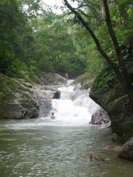Locals enjoy the waterfall at Pozo Azul near Santa Marta, Colombia. Ariel Quintana photos.