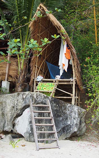 A makeshift bedroom on a beach for the night.