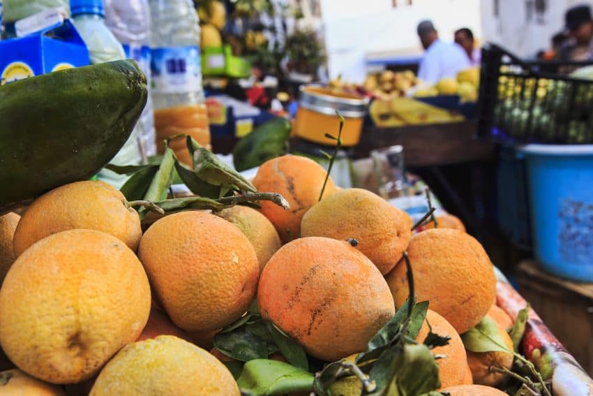 A fruit stand in a back street.