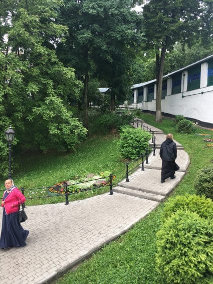 A monk and an employee at the Lavra Monastery