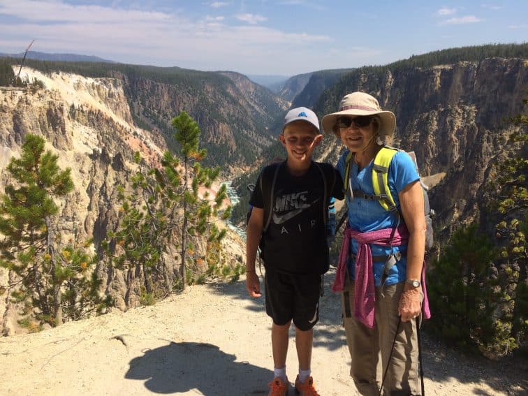 Two generations of travelers at Yellowstone.