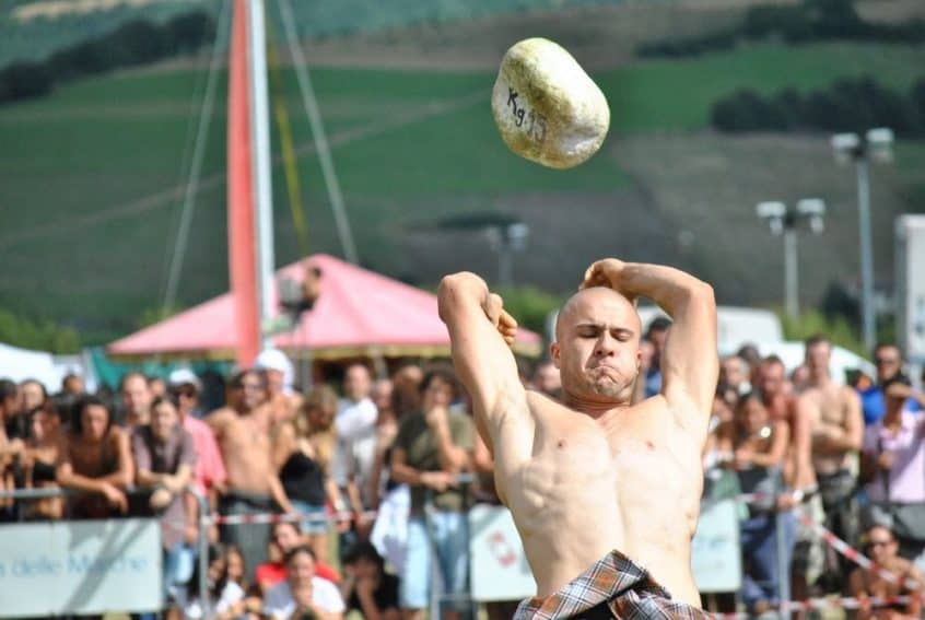 A competitor tosses a 15 kg stone at the Celtic Festival in Montelago, Italy Celtic Games - tossing the stone at the Celtic Festival in Montelago, Italy
