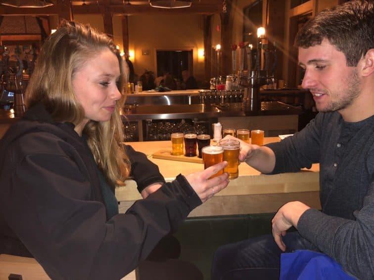 Two patrons enjoy a flight of house-brewed beers at the Trapp brewhouse.