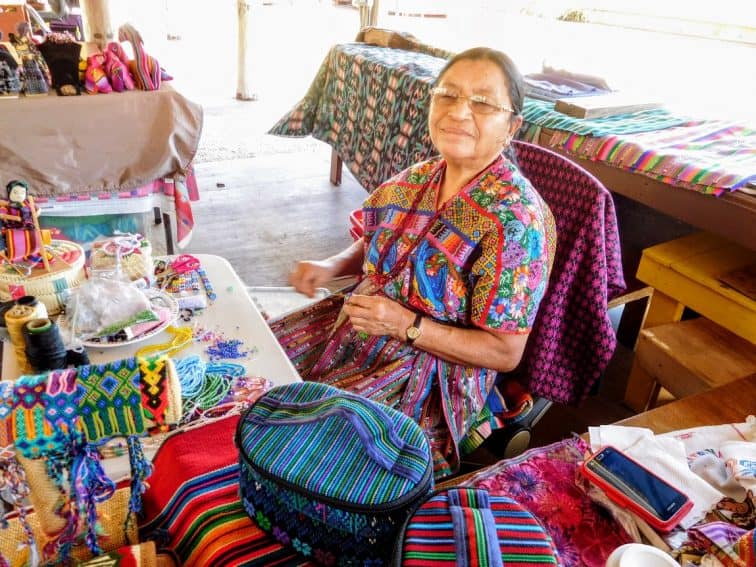 Miccosukee Indian doing beadwork in the Florida Everglades south of Miami.