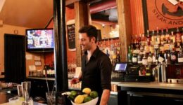 Tyler bartending at Seared