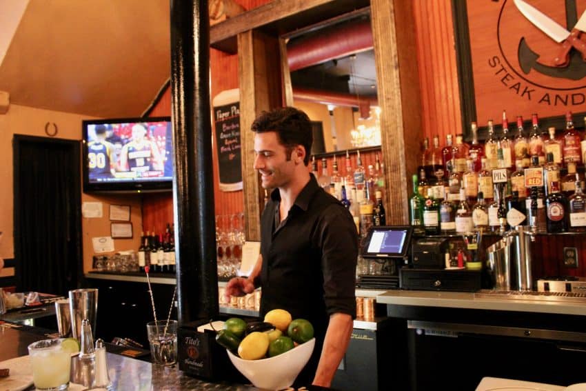 Tyler bartending at Seared