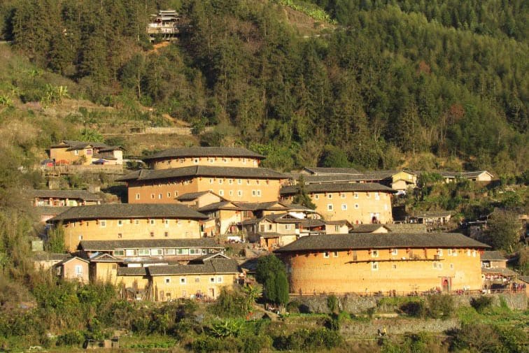 China: The Earthen Fortresses of the Hakka 1 The spectacularly located Tianluokeng Snail Pit tulou cluster in the Hakkas.