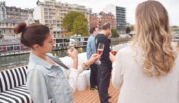 U by Uniworld cruisegoer takes a photograph of her drink.