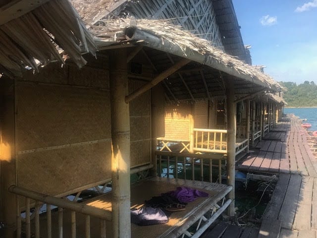 The porches and dock connecting the raft houses on Chiaw Laan Lake, Thailand. | GoNOMAD Travel