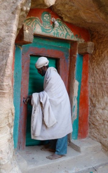 A Travel Junkie's Traveling Tales 5 Behind this door is a vast church hewn into the cliff wall.
