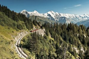 Roll through the mountains by train. Photo from the Swiss Travel System.