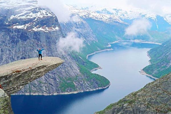 A 30,000 Kilometer Road Trip Through Europe 1 Atop Trolltanga in Norway. | GoNOMAD Travel