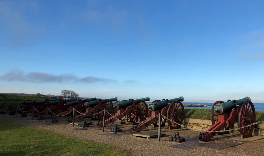 Cannons overlooking the water at Kronborg Castle, outside of Copenhagen. | GoNOMAD Travel Cannons overlooking the water at Kronborg Castle, outside of Copenhagen. | GoNOMAD Travel