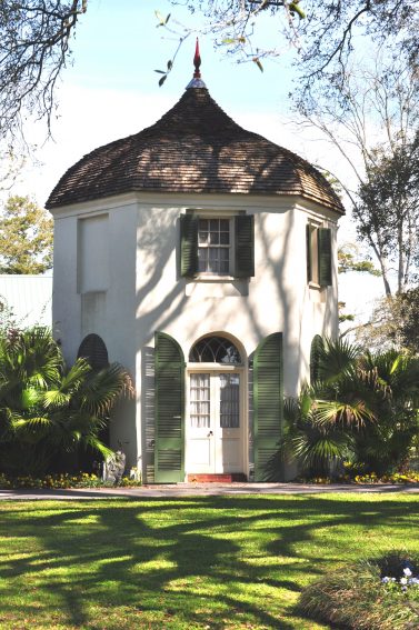 Houmas House has two historic garçonnière structures, each featuring the iconic shape for which the plantation is known, and one of these houses the cool and inviting Turtle Bar at the Carriage House restaurant entrance. | GoNOMAD Travel