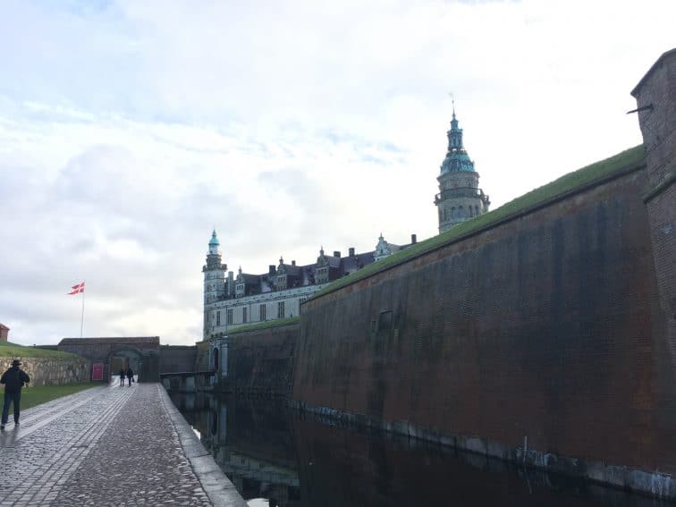 Kronborg Castle in the background with its moat and bastion in front. | GoNOMAD Travel Kronborg Castle in the background with its moat and bastion in front. | GoNOMAD Travel
