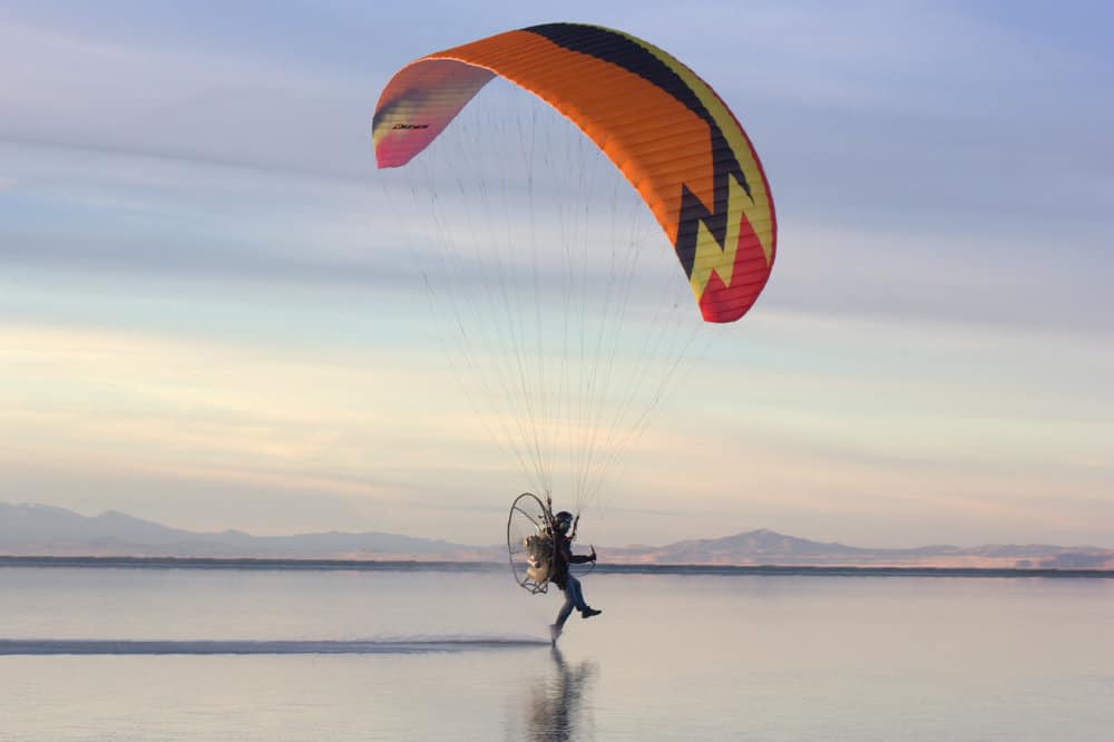 Skimming across the water on a motorized parasail.