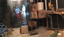 A hologram is shown in the garage where Oswald hid his rife.
