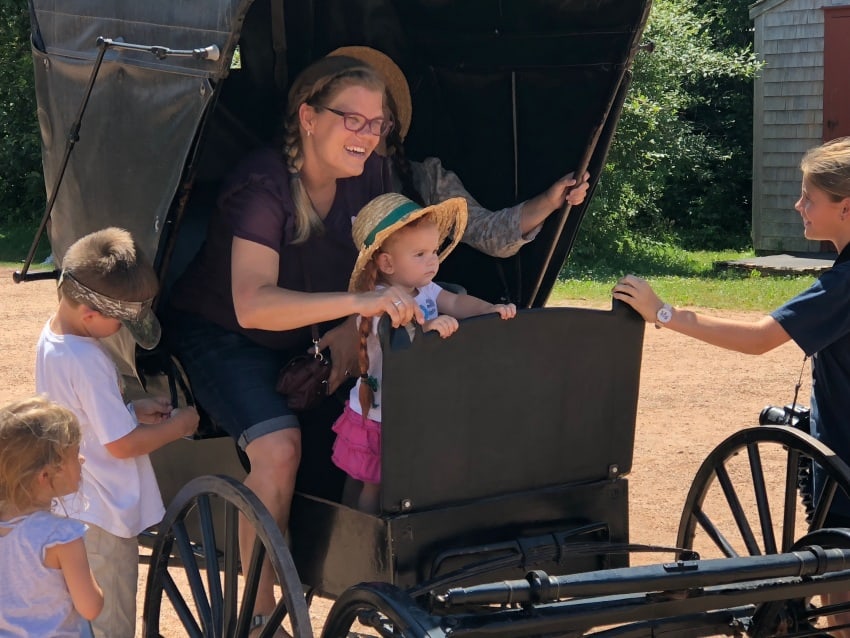 At the Anne of Green Gables Heritage House, everyone wants to wear Anne's braids and straw hat!