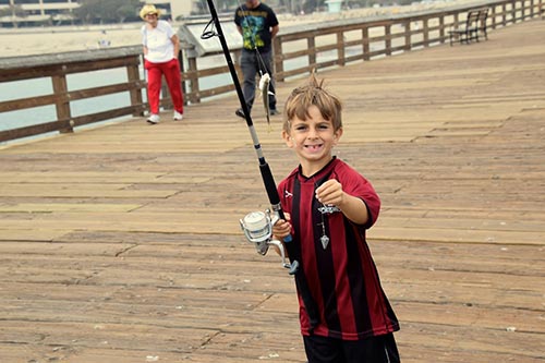 Look mom, I caught a big one! Tall fishing tales with Knox Nehdar on the Ventura pier.