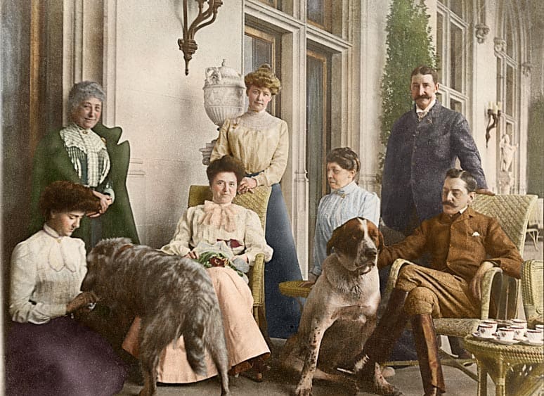 This colorized version of a photograph from the Vanderbilt archives depicts afternoon tea on the Loggia of Biltmore House with the Vanderbilts, September 1900.