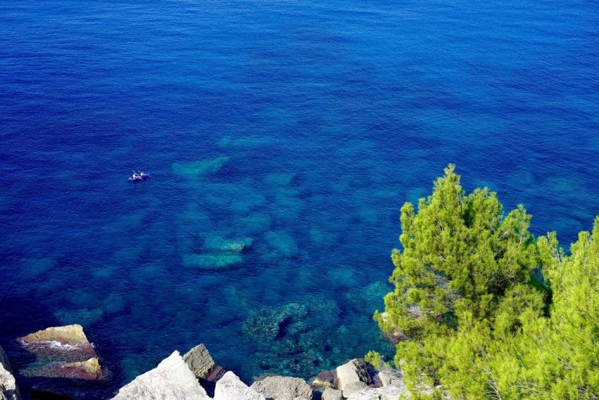 At the end of the hike you can finally splash into crystal clear waters.