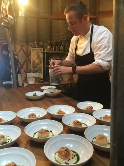 Chef Craig Gerome preparing the second course in the Yurt