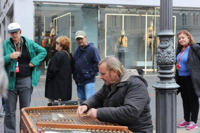 Zither player Bonn (Woman on right has on one of those whisperer gadgets) Zither player Bonn Germany