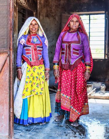 A mum and daughter who, by day, take care of the Garasia tribal village.